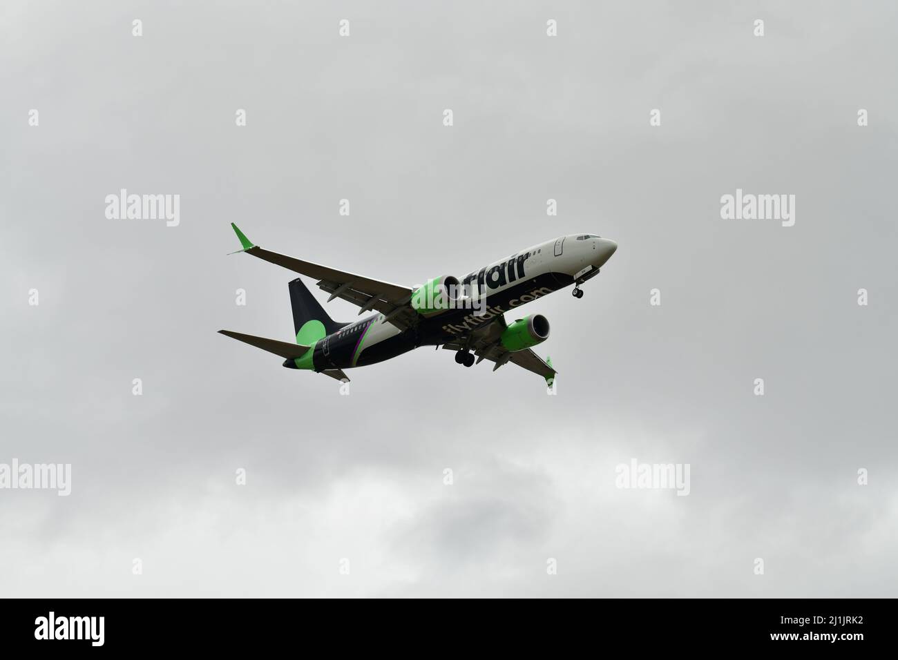 A passenger airplane lands at Pearson international airport in Toronto Canada in cloudy weather Stock Photo