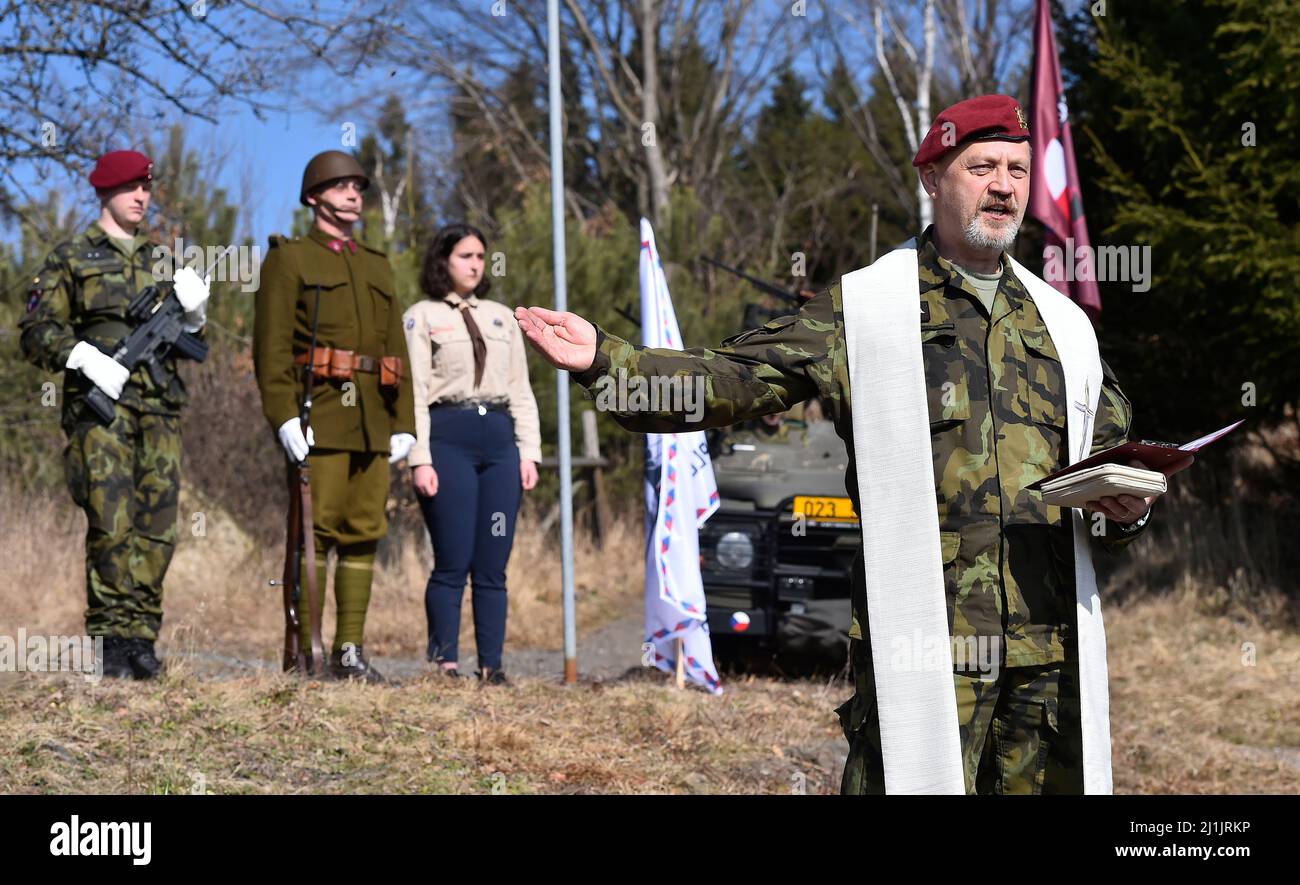 Orechov, Czech Republic. 26th Mar, 2022. Army chaplain Petr Haska speaks to several dozen people who come to remembered the 80th anniversary of the parachute jump of the group Out Distance in Orechova, Jihlava region, Czech Republic on March 26, 2022. Members of the Out Distance were participating on the assasination of Reinard Heydrich. War veterans and local people paid tribute by the monument. Historical and contemporary army technique, parachute jumps and fight demonstrations were shown. Credit: Lubos Pavlicek/CTK Photo/Alamy Live News Stock Photo