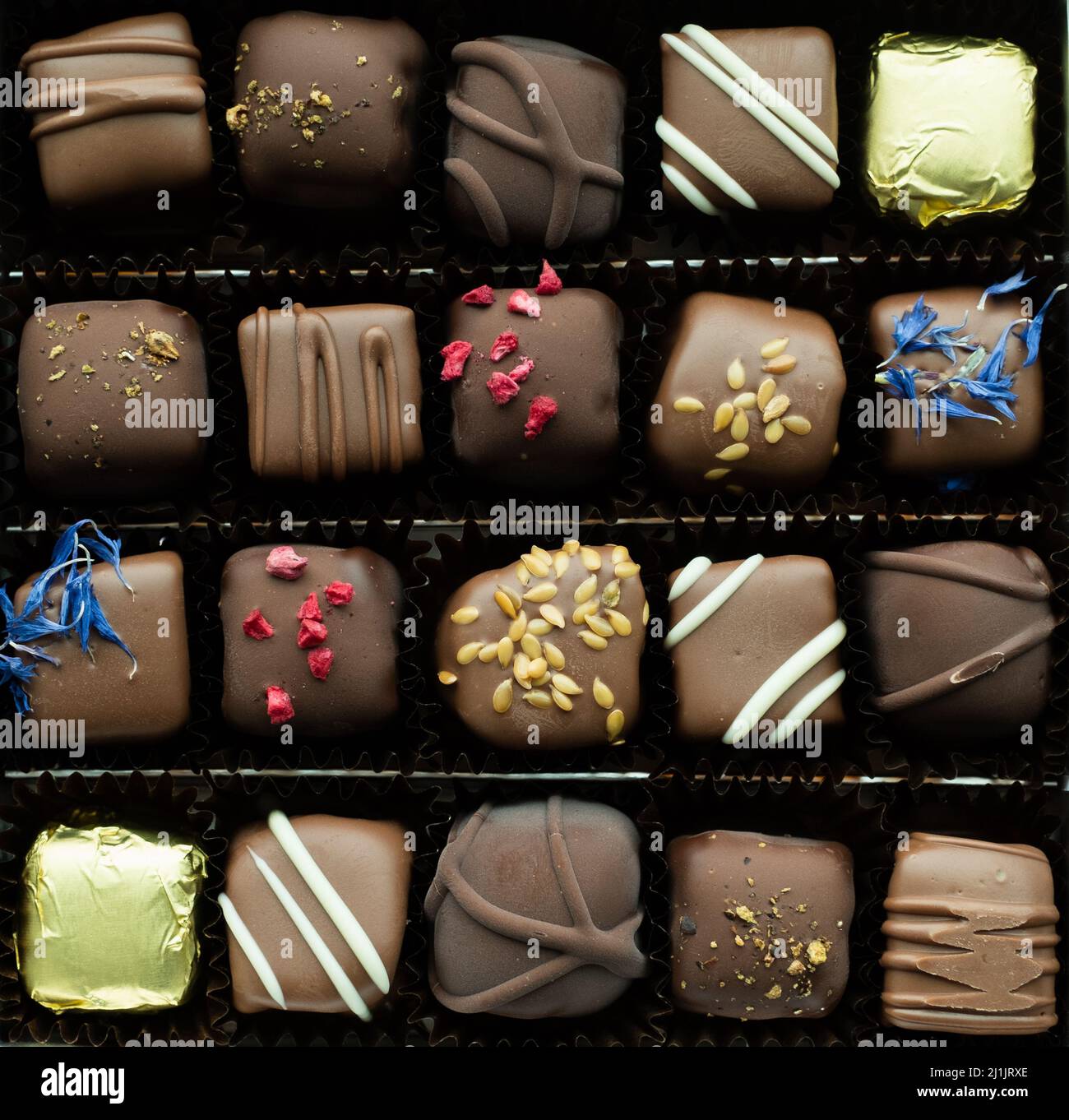 Box of delicious handmade chocolates. Stock Photo