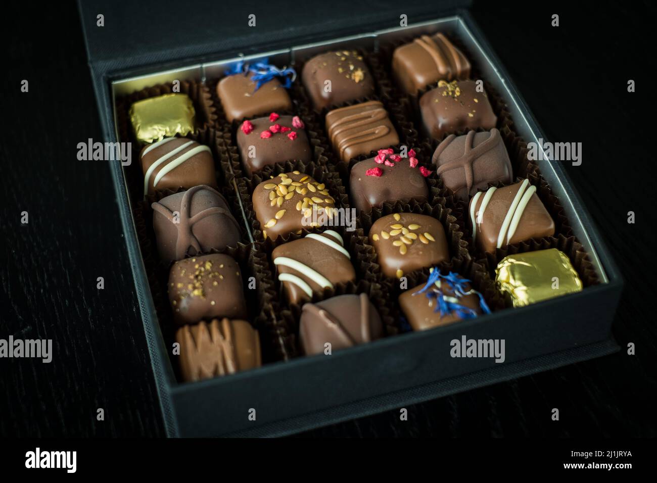 Box of delicious handmade chocolates. Stock Photo