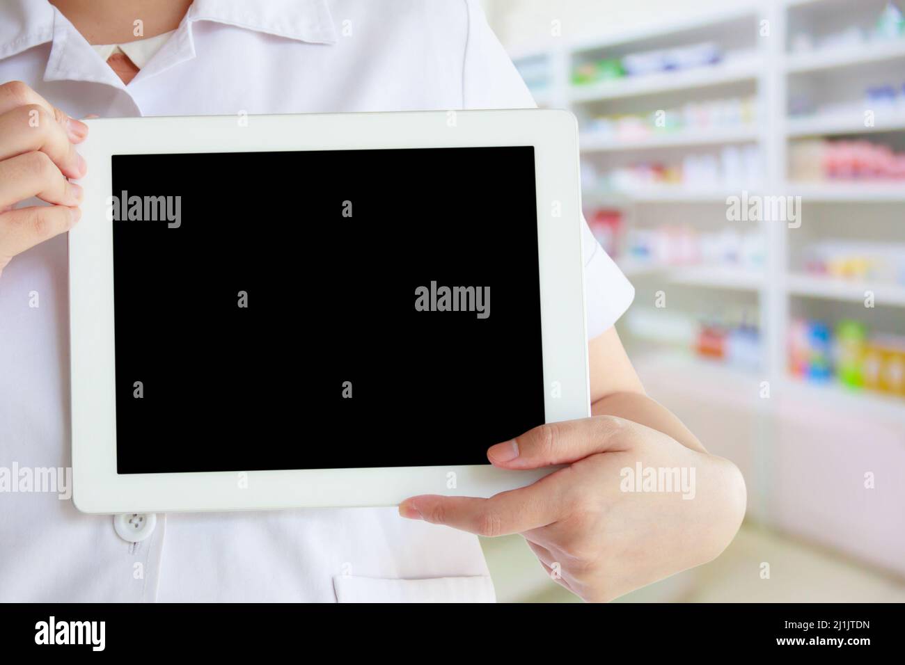Pharmacist Using A Computer Pharmacist holding computer tablet using hi-res stock photography and ...