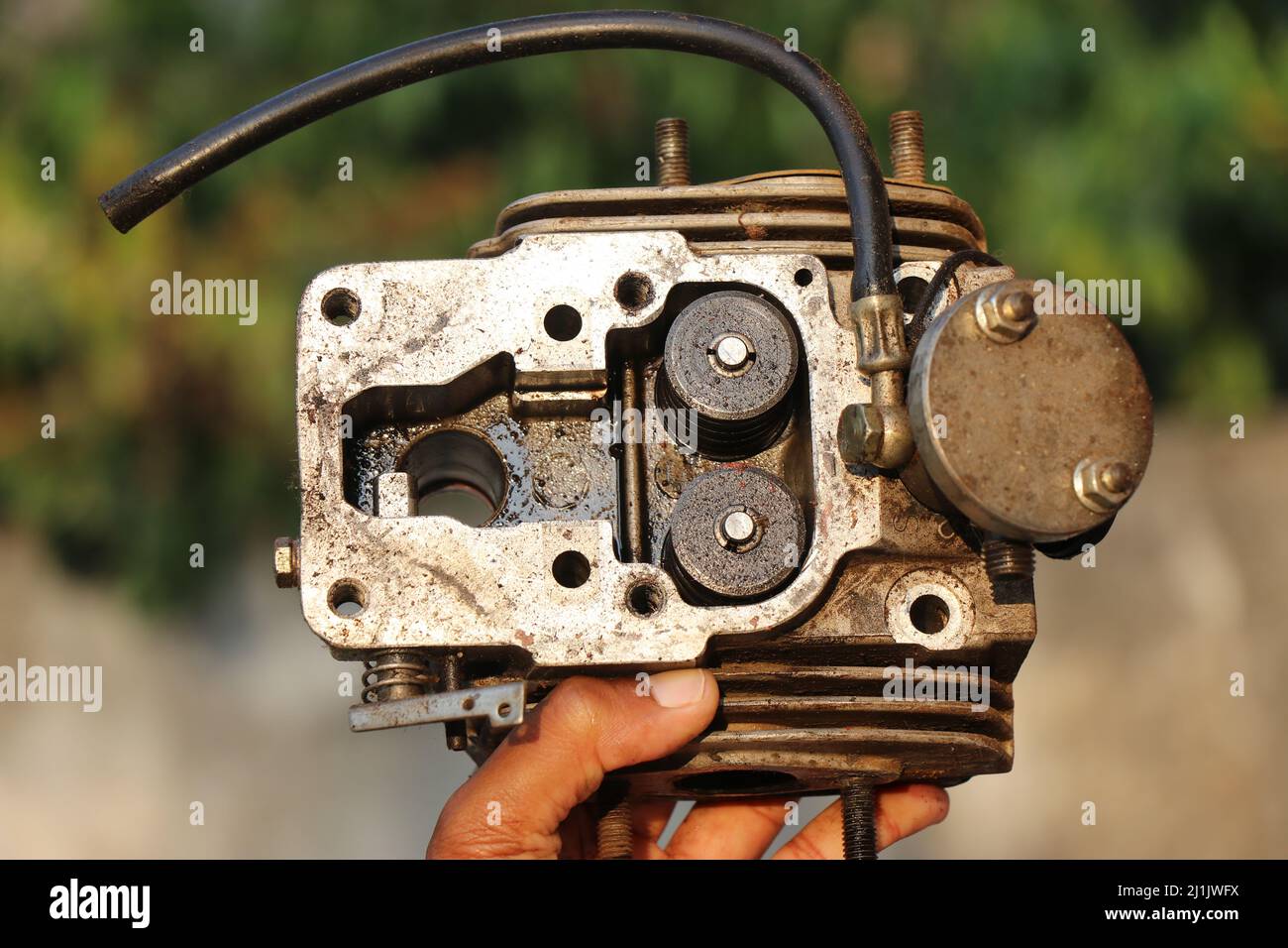 Diesel engine cylinder head with fuel inlets and fins for cooling disassembled aluminum diesel engine cylinder head Stock Photo