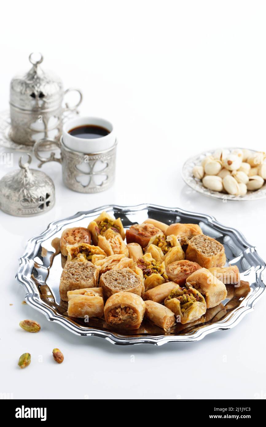 Mix Baklava Dish or Baklawa is Arabic and Turkish Traditional Sweets with Pistachio. Served with Turkish Coffee, Selected Focus Stock Photo