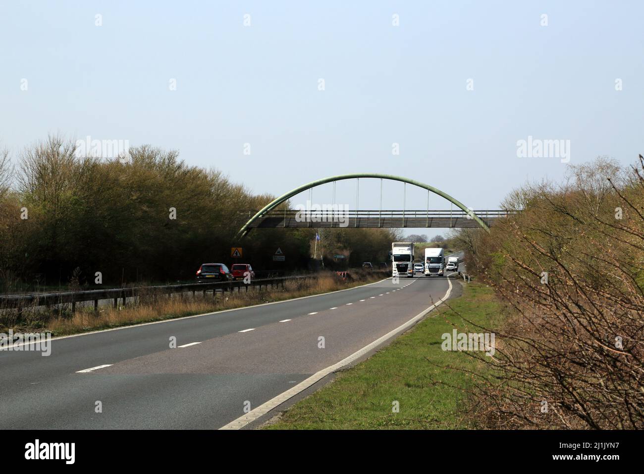 View of A2 with traffic and footbridge near Kingston, Canterbury, Kent, England, United Kingdom Stock Photo