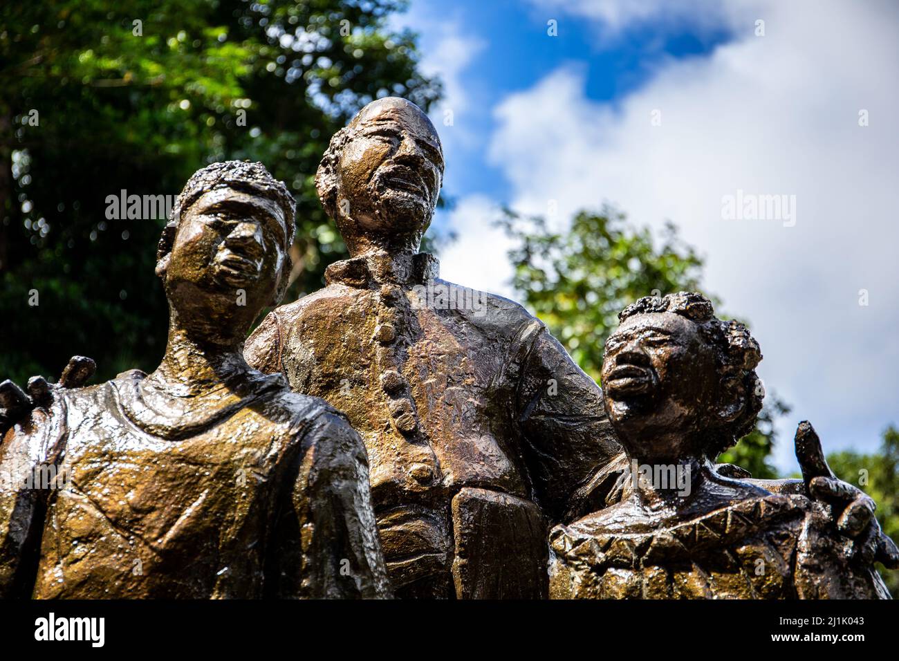 Mahe, Seychelles, 3.05.2021. The Liberated Slave Monument depicting three sculpted statues of Liberated Slave children and Headmaster, Venn's Town. Stock Photo