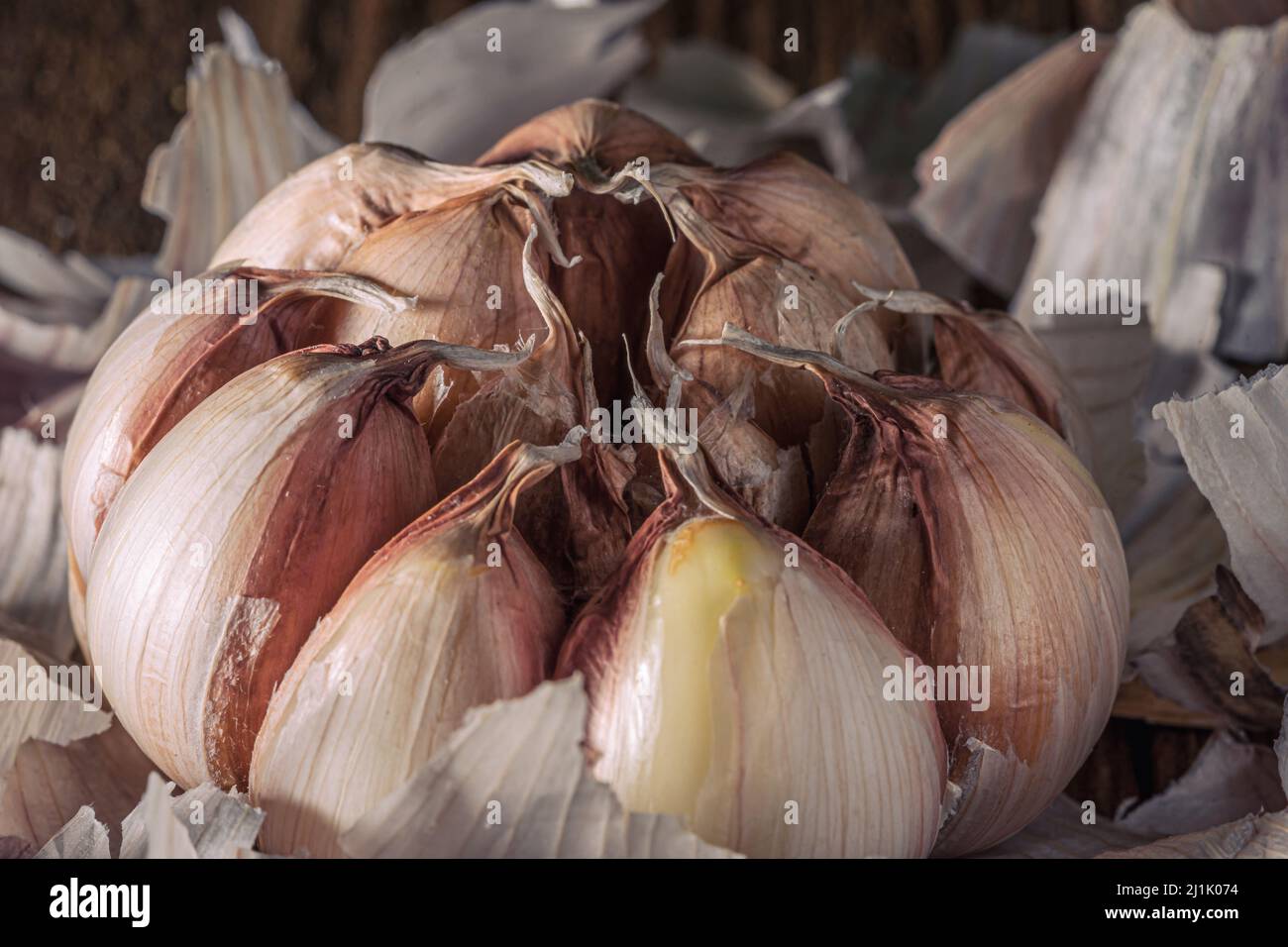 Garlic bulb, peeled back Stock Photo Alamy