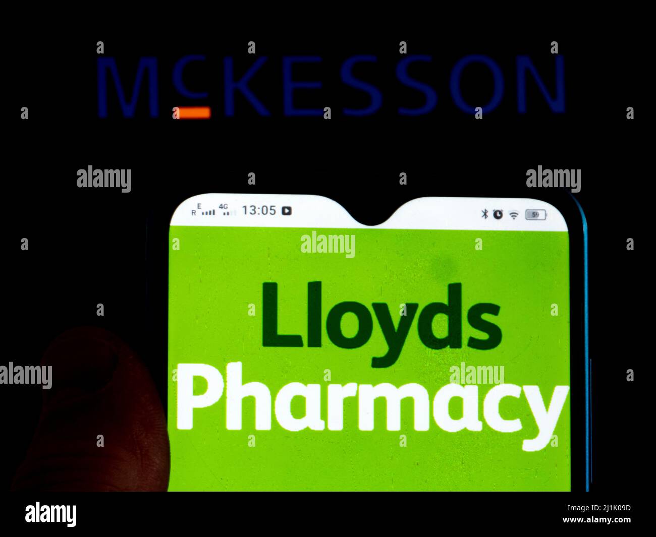 In this photo illustration, the Lloyds Pharmacy is displayed on a