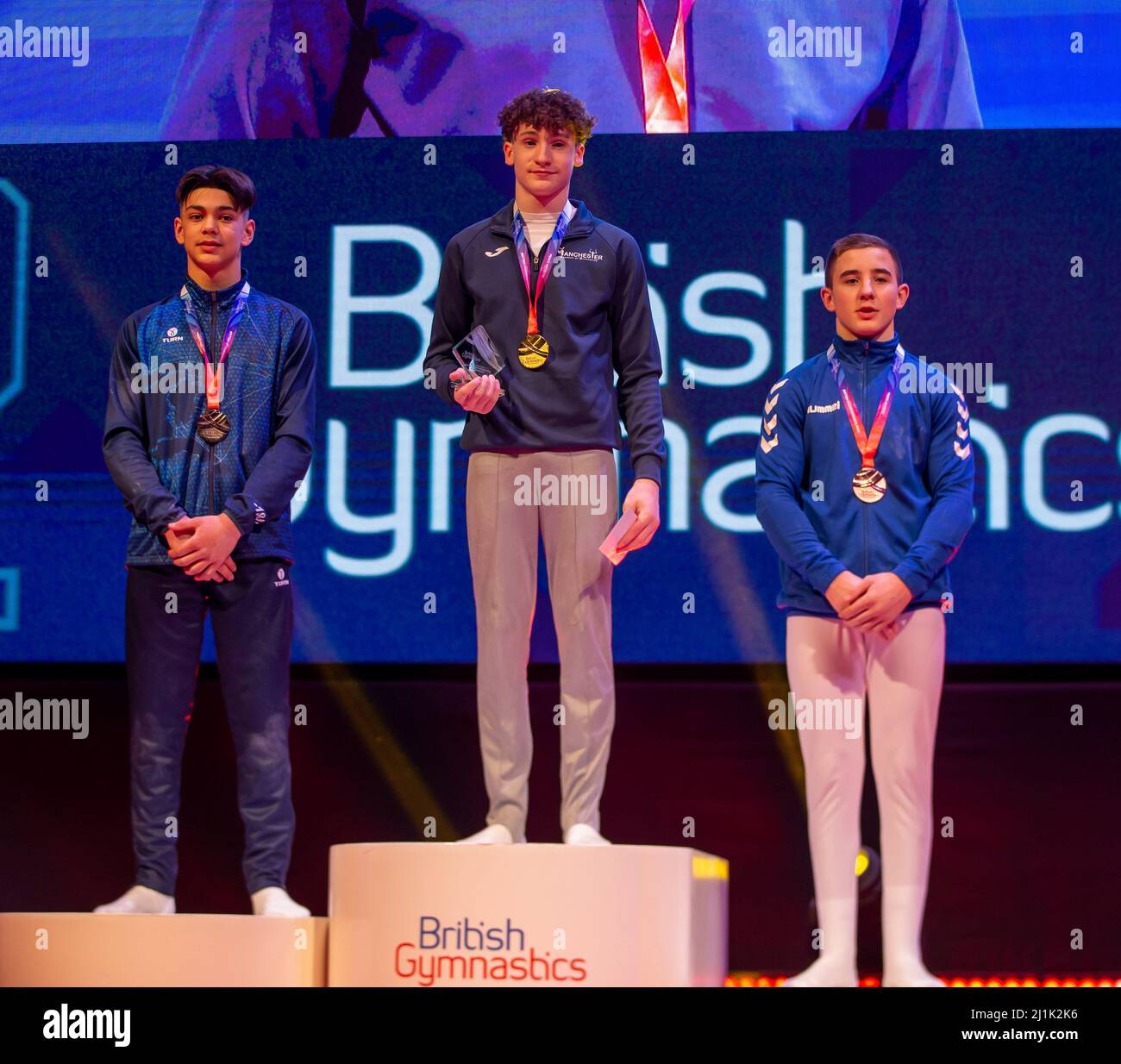 Liverpool, UK. 26th Mar, 2022. 26th March 2022 ; M&amp;S Arena, Liverpool, England; British Gymnastic Championships Day 3; Mens Under 18 All Around medallists, Danny Crouch Bronze (R), Oakley Banks Silver (L) and Gold, Reuben Ward (C) of Manchester Acadamy of Gymnastics Credit: Action Plus Sports Images/Alamy Live News Stock Photo