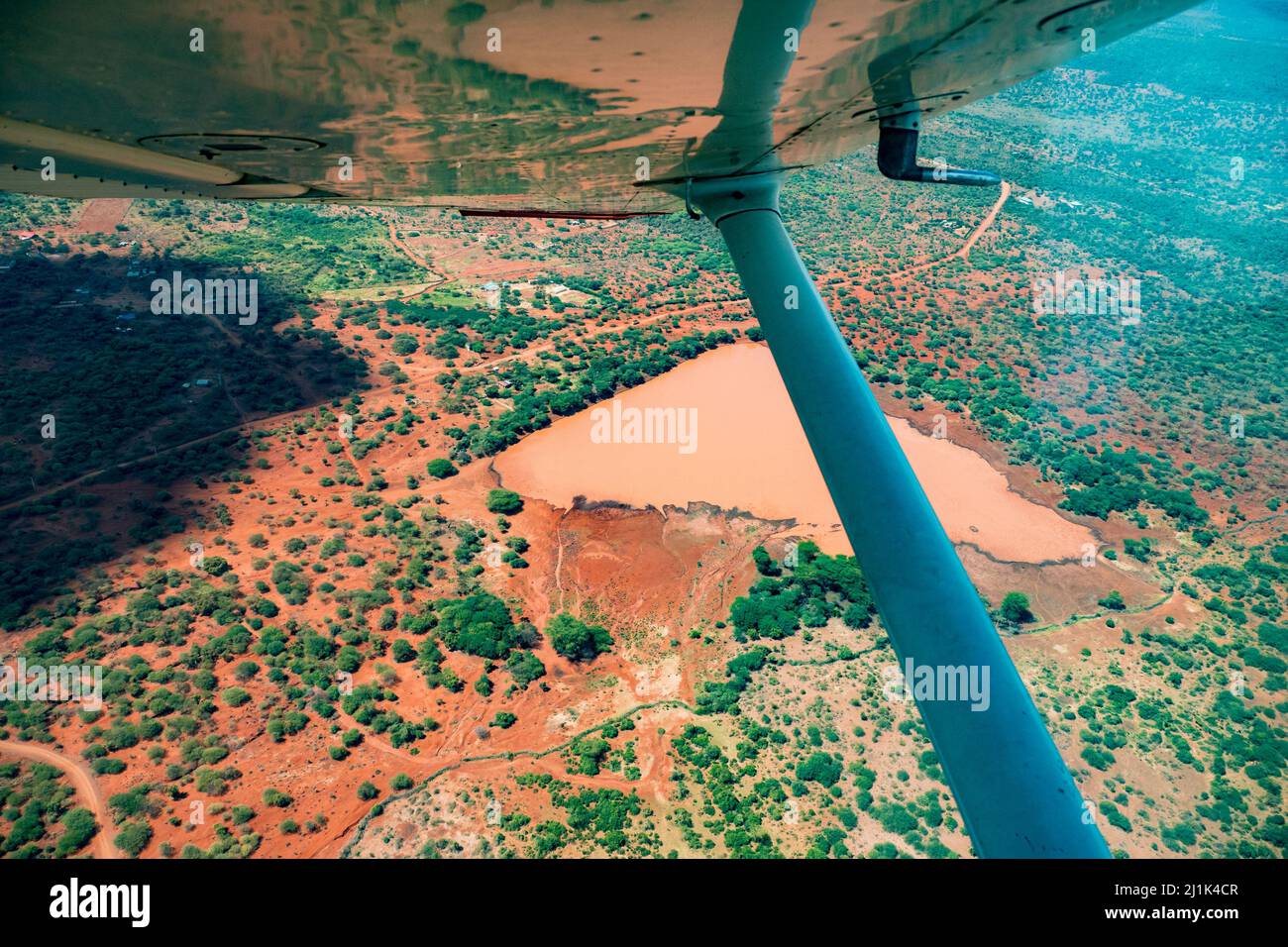 Beautiful view of the picturesque landscape of the Great Rift Valley from the window of a small sports plane flying over the Kenyan savannah Stock Photo