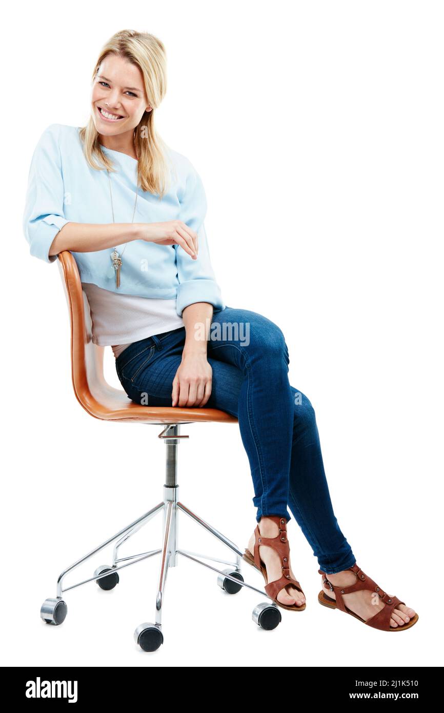 Feeling happy and relaxed. Life is good. Studio portrait of a happy young woman sitting on a chair against a white background. Stock Photo
