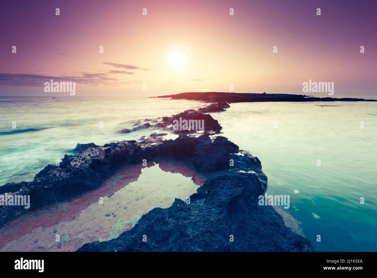 Amazing morning sun over the sea. Volcanic island of Malta. Qawra