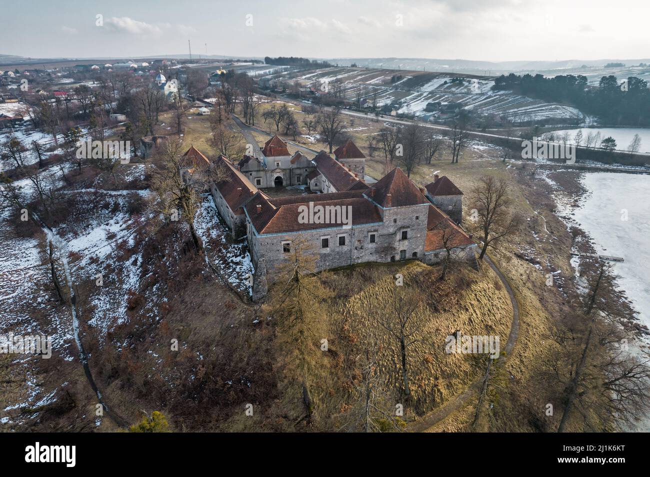 Aerial view over Svirzh Castle, Ukraine. It is a fortified aristocratic residence in Lviv region, built in 15th century. Famous movie DArtagnan and th Stock Photo