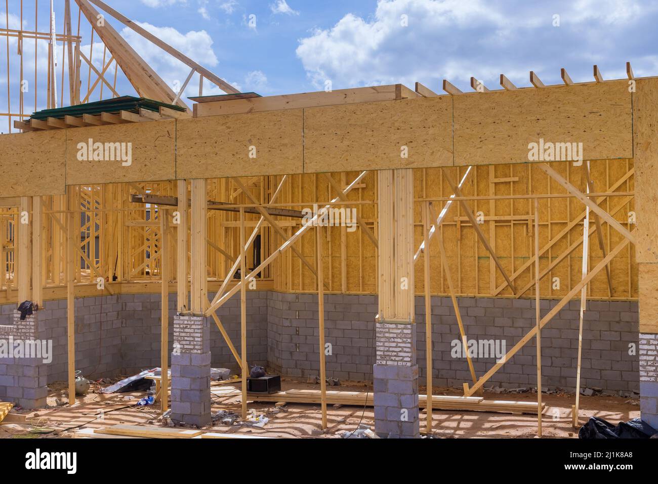An aerial top view of stick built home under construction with wooden