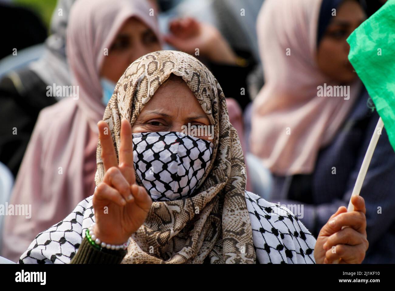 Gaza, Gaza Strip, Palestine. 26th Mar, 2022. Gaza Strip, Palestine. 26 March 2022. Palestinians hold a vigil to commemorate 'Land Day'' in the refugee camp of Malaka, in the eastern Gaza Strip. Participants remembered the Palestinian 1976 resistance towards confiscation of Palestinian land by Israel in the Galilee and the victims of the protest. Demonstrators also maintained their determination to continue fighting for their land and rights amidst the ongoing illegal expropriation of Palestinian land by Israel and the Zionist colonial project. The National Commission for the Support of the Stock Photo