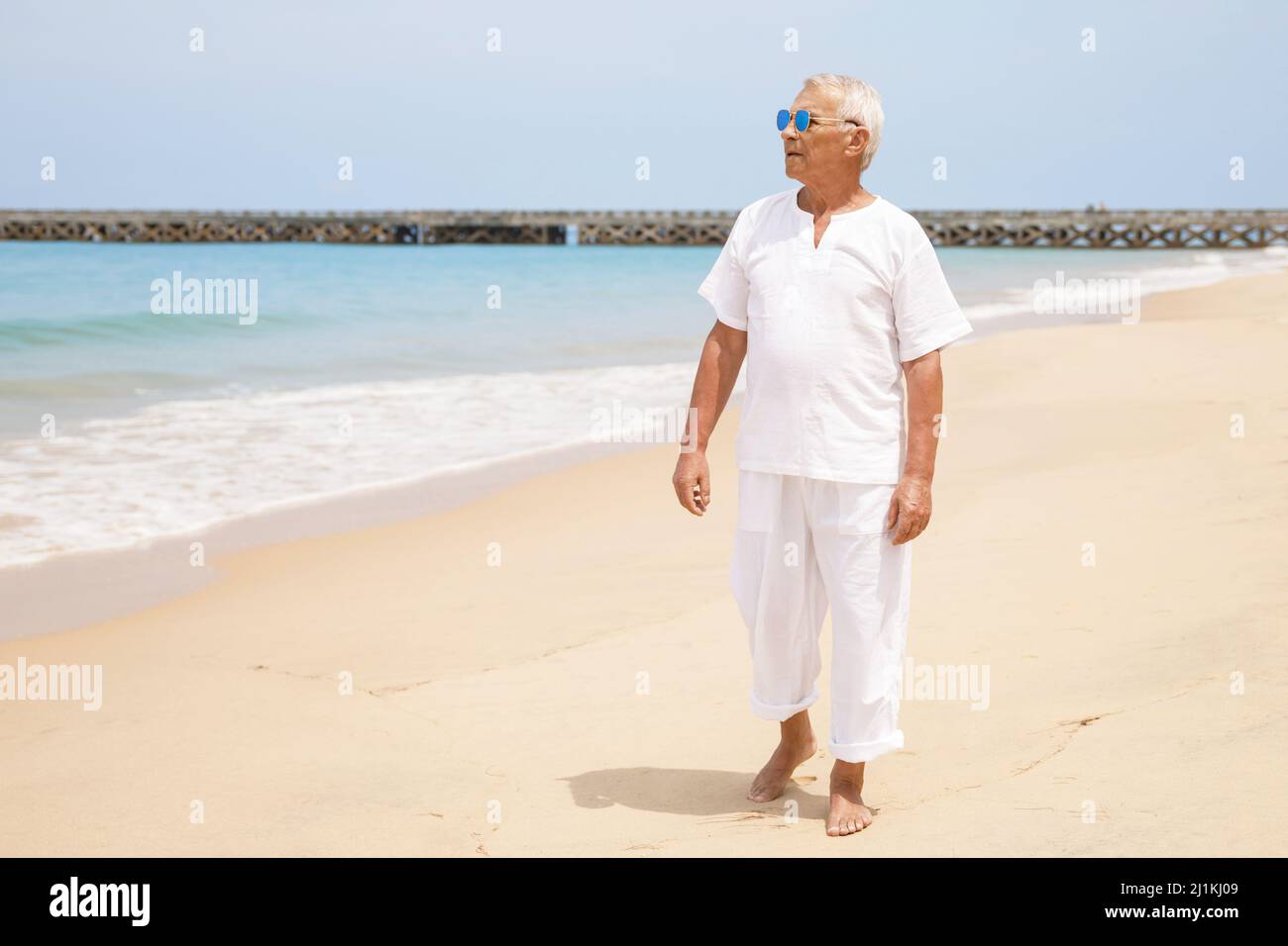 Sun tanned man walking hi-res stock photography and images - Alamy