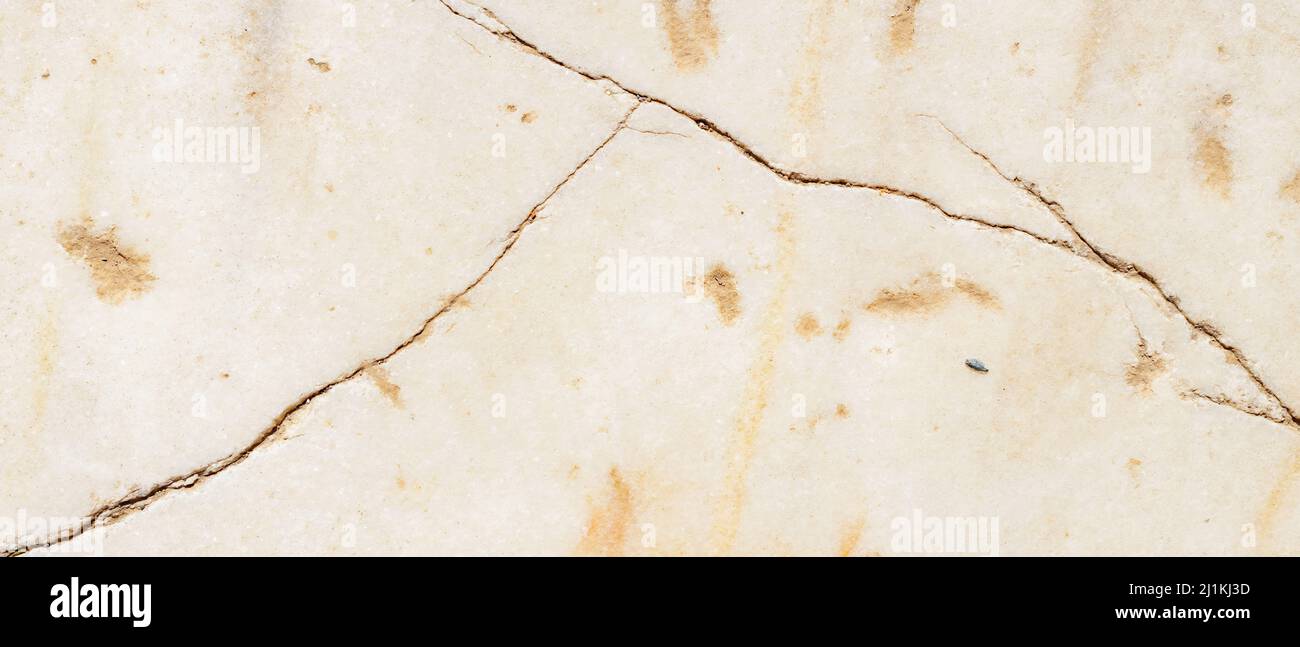 Cracked antique marble texture. Weathercracked stone wall. Marble