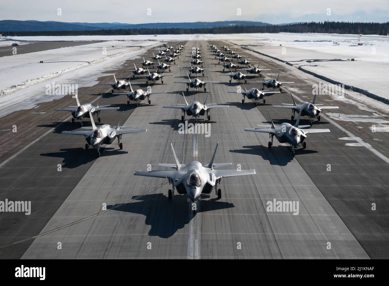 Fairbanks, United States. 25th Mar, 2022. A formation of U.S. Air Force F-35 Lightning II aircraft assigned to the 354th Fighter Wing, perform an Elephant Walk at Eielson Air Force Base March 25, 2022 in Fairbanks, Alaska. An Elephant Walk is a maneuver to scramble fighter aircraft using minimum interval takeoff. Credit: A1C Jose Miguel Tamondong/U.S Air Force/Alamy Live News Stock Photo