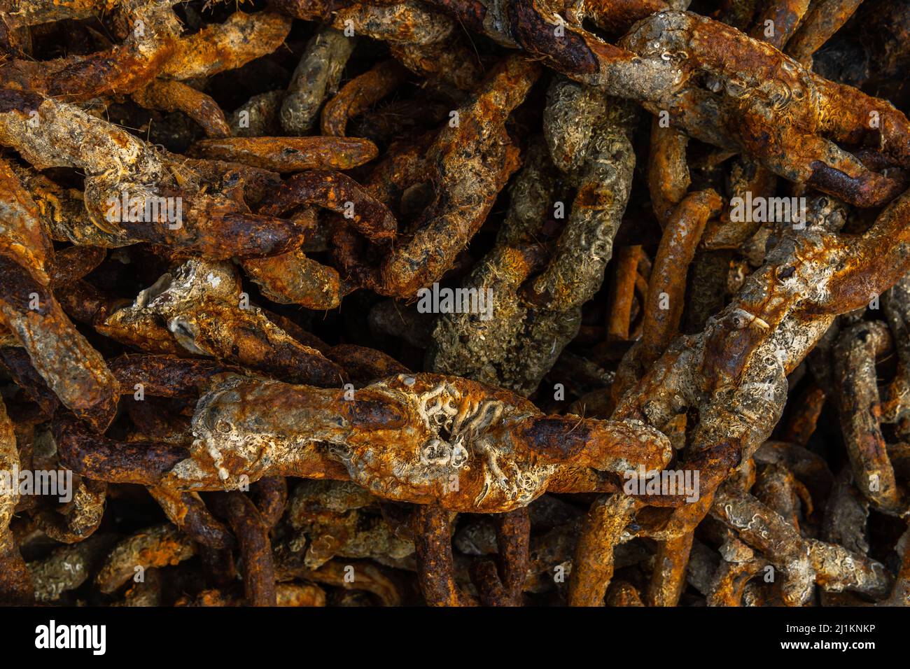 Close-up of rusted metal chains from a ship's anchor. Background image with nautical theme Stock Photo