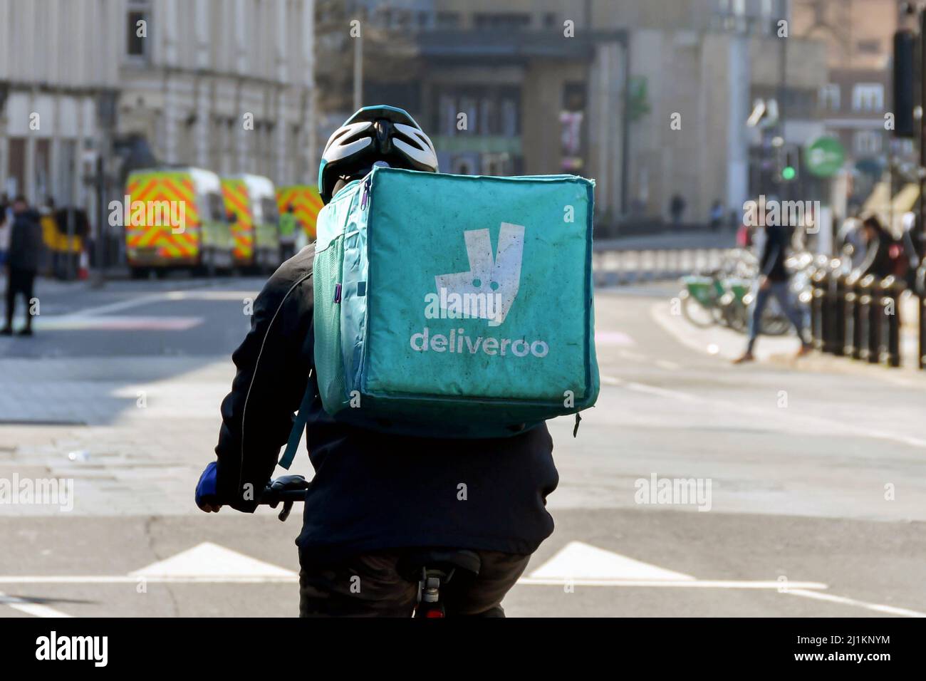 Cardiff, Wales March 2022 Cycle courier for the Deliveroo food