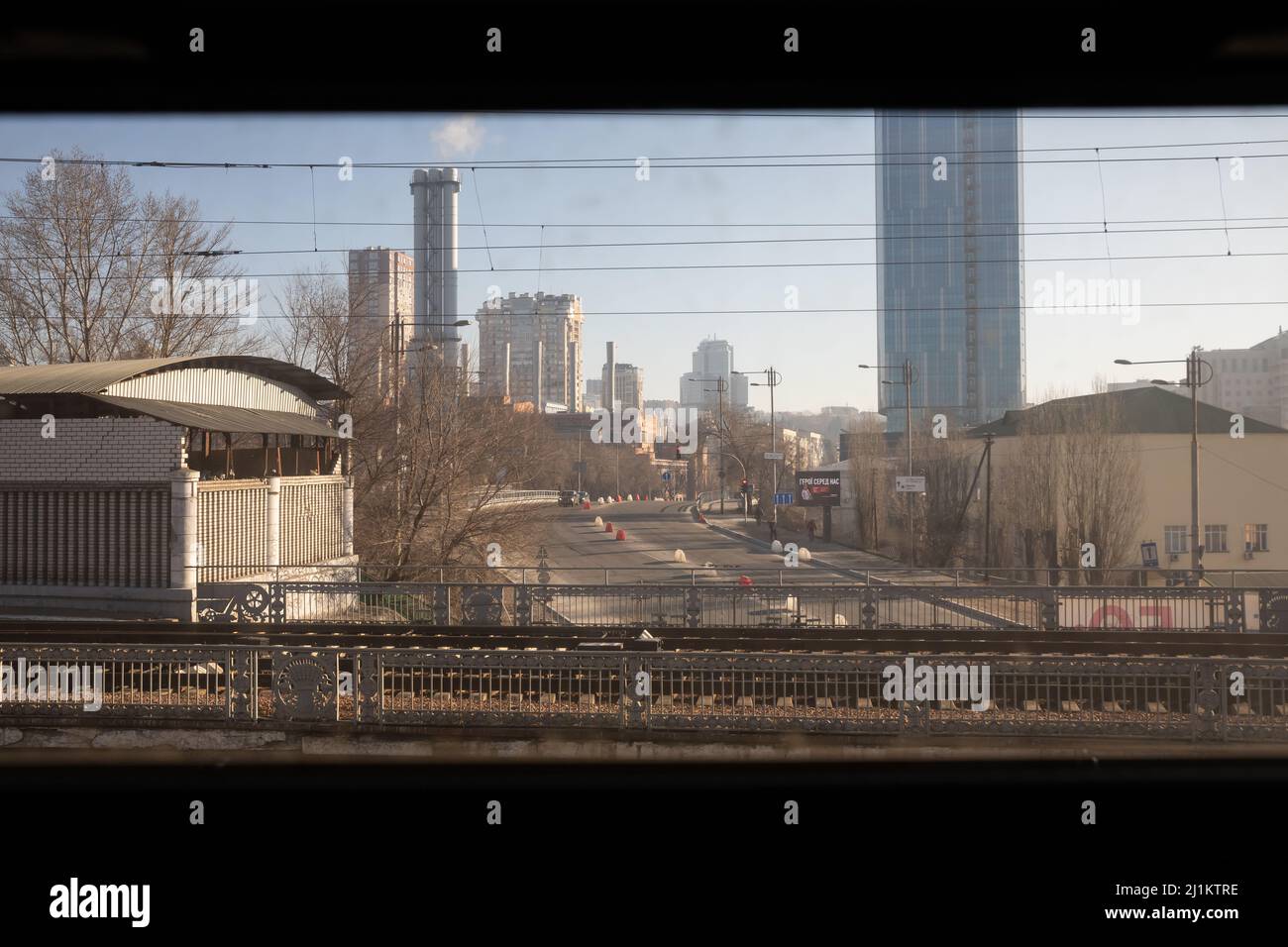 View of the city from the train window during arrival at Kiev Central Railway Station, 23 March 2022 Stock Photo