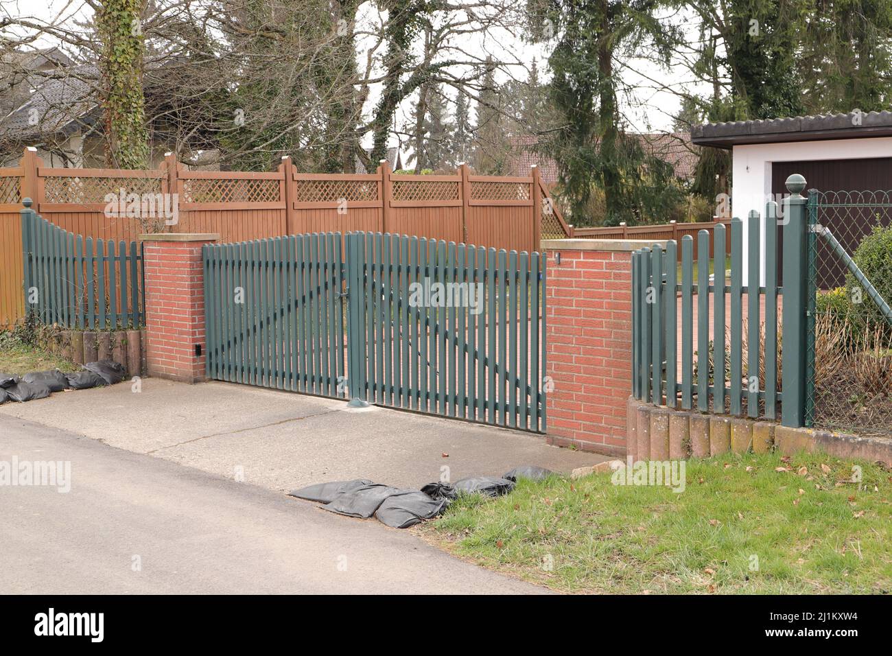 a new house with a driveway gate Stock Photo