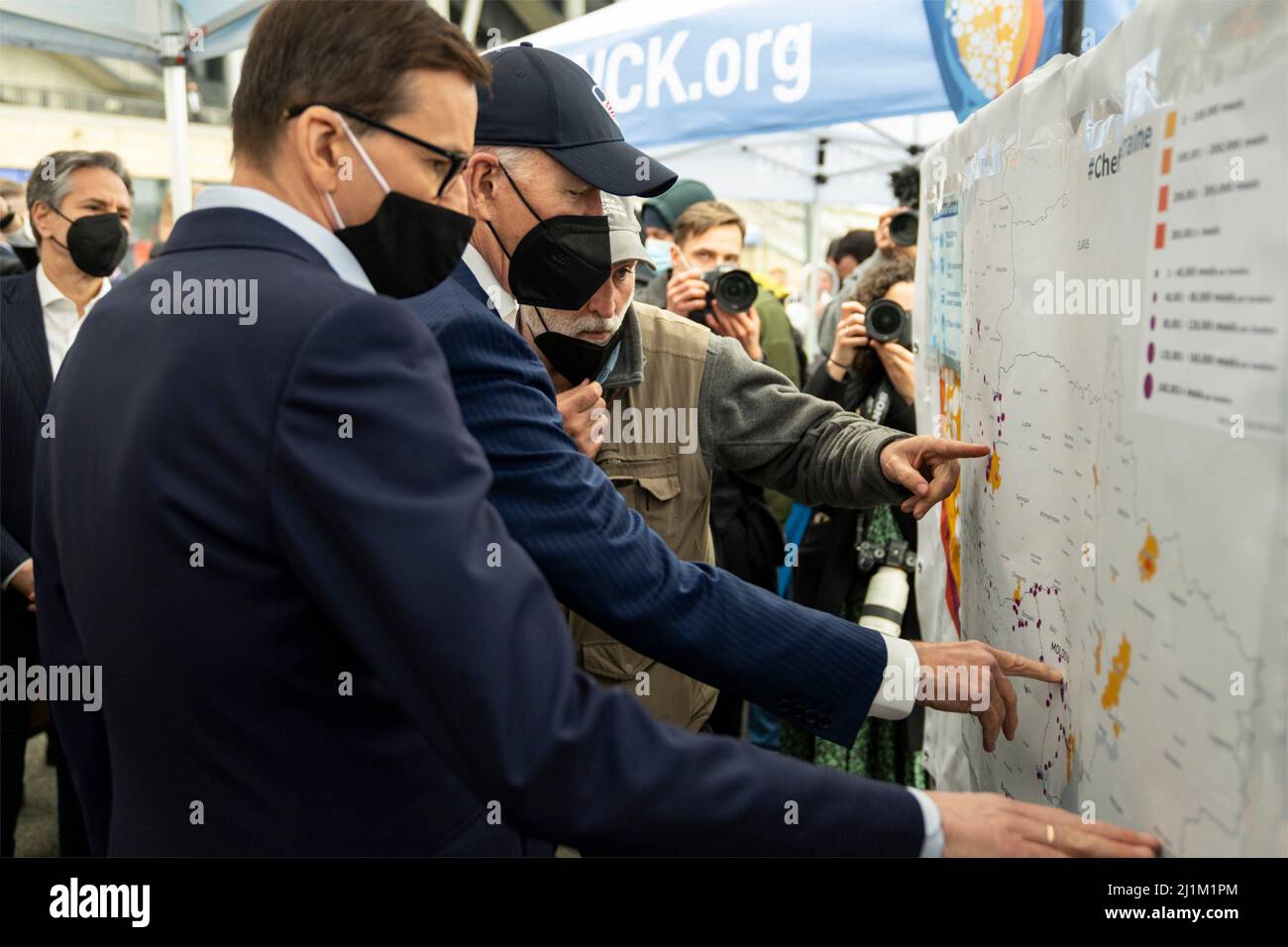 Warsaw, Poland. 26th Mar, 2022. Polish Prime Minister Mateusz Morawiecki, left, and U.S President Joe Biden, center, view a map showing where Ukrainian refugee are fleeing the Russian invasion at PGE Narodowy Stadium, March 26, 2022 in Warsaw, Poland. Credit: Adam Schultz/White House Photo/Alamy Live News Stock Photo