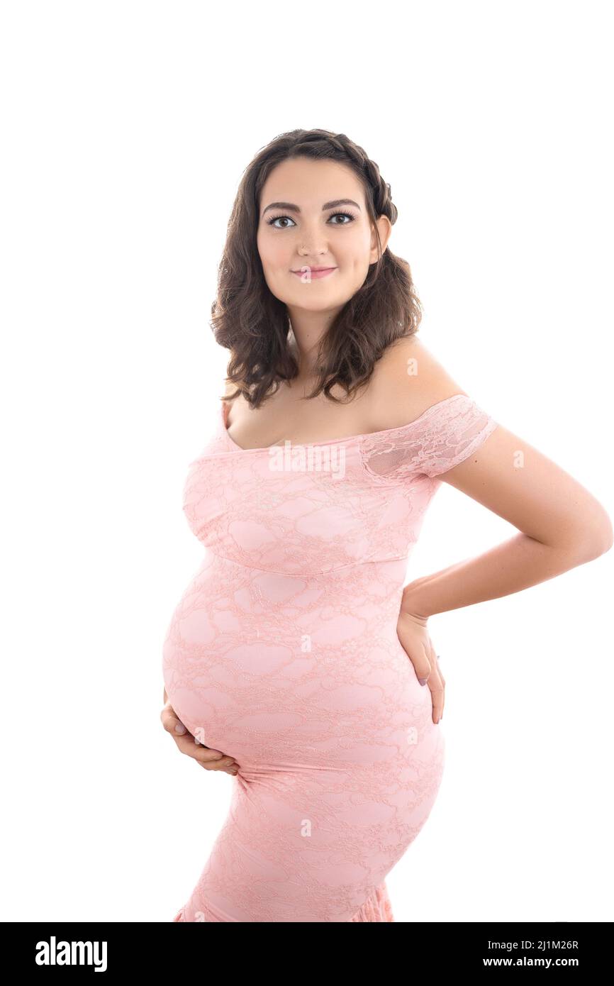 Studio Maternity Portrait of a Pregnant Women in a Beautiful Gown Stock Photo