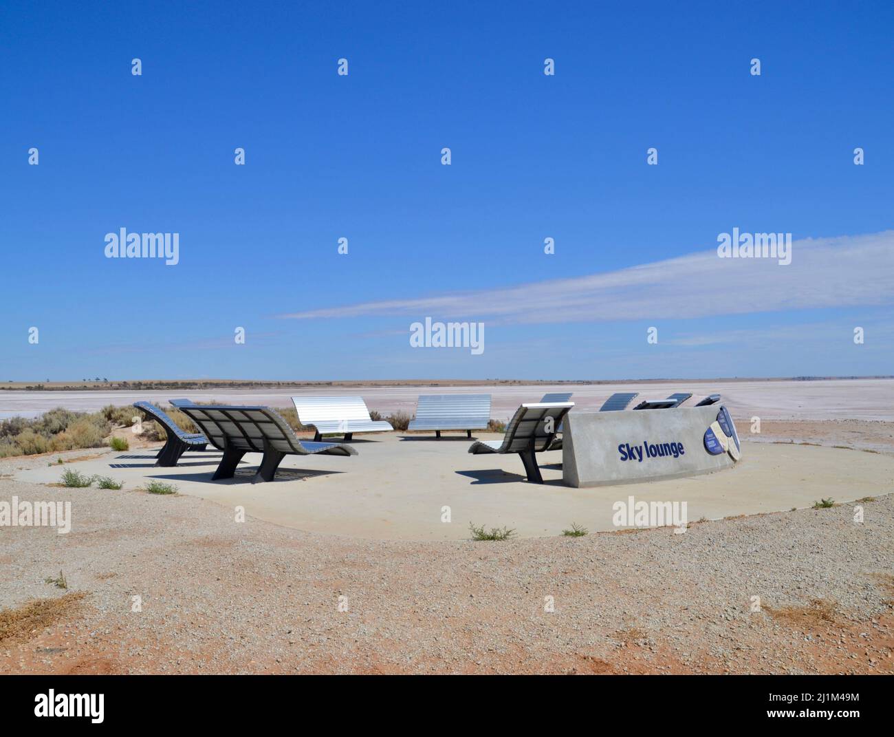 These benches are called the Sky Lounge and are set in a circle for people to go and look at the stars at Lake Tyrrell in outback Australia Stock Photo