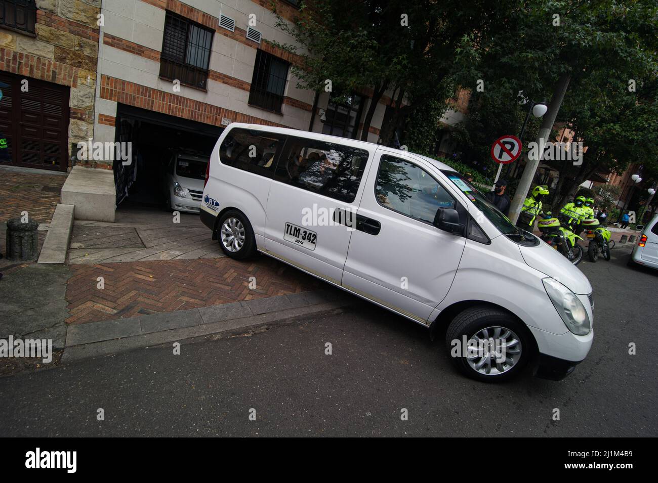 Bogota, Colombia. 26th Mar, 2022. Vans in a motorcade transport the Foo  Fighters outside after the death of Taylor Hawkins, drummer of the Foo  Fighters death during the night of March 25