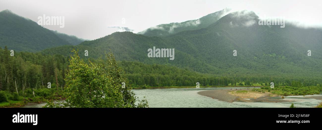 Geography, physiography. Panorama of the Altai mountains (spurs) and valleys with deciduous forest and floodplain forests and mountain riffle river. Stock Photo