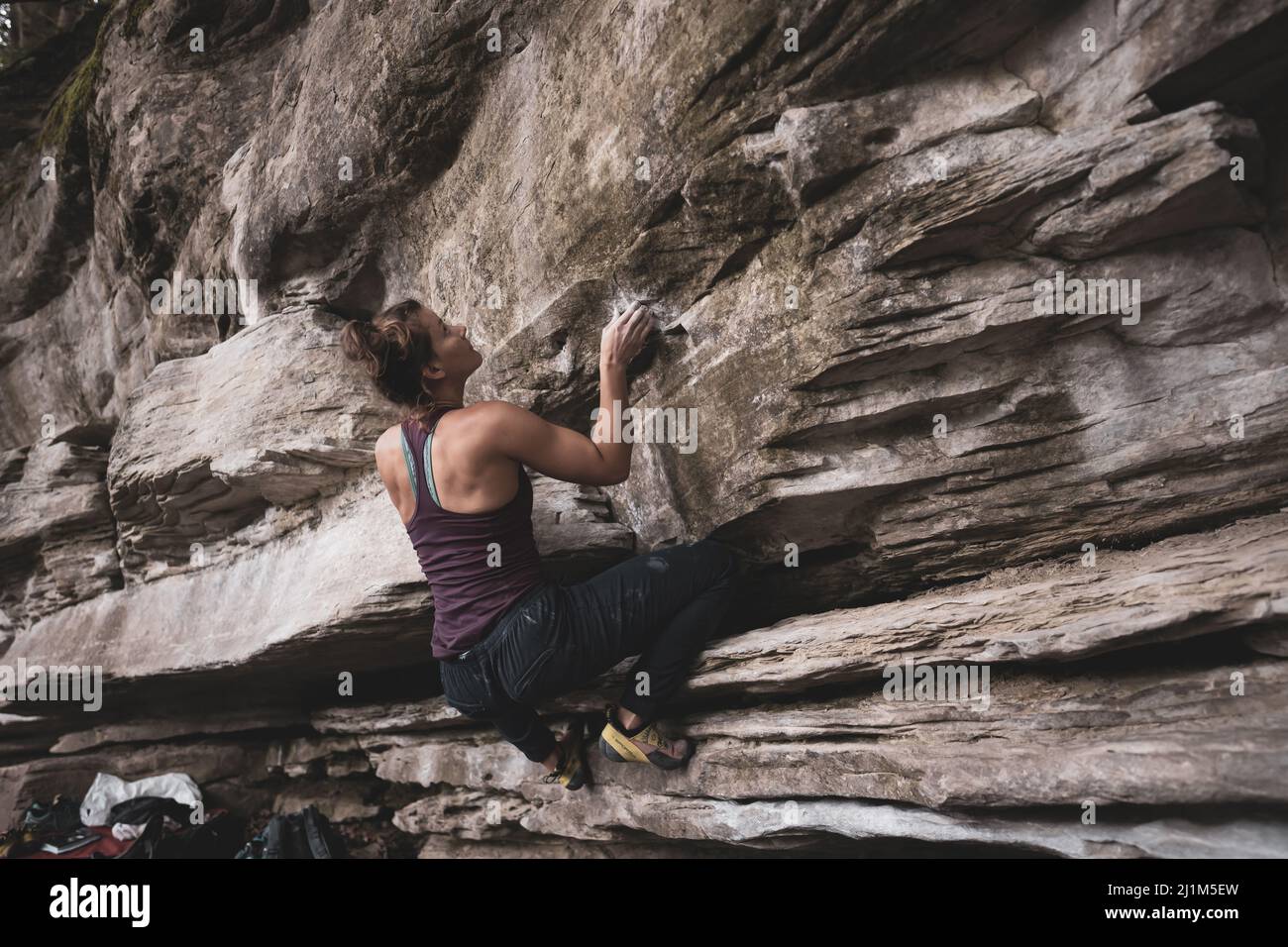 Woman bouldering at Kammeregg in Allgäu Stock Photo