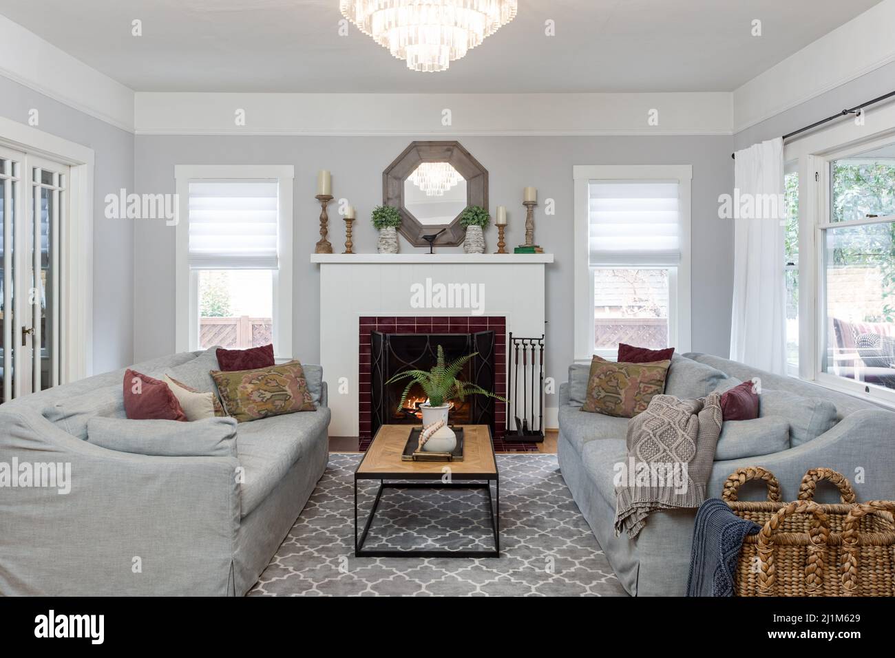 Living Room with Fireplace and Chandelier Stock Photo Alamy