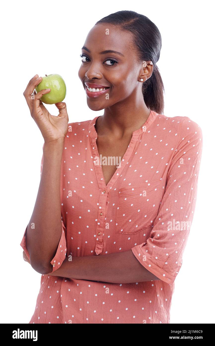 Shes into eating healthily. Portrait of an attractive young woman holding an apple. Stock Photo