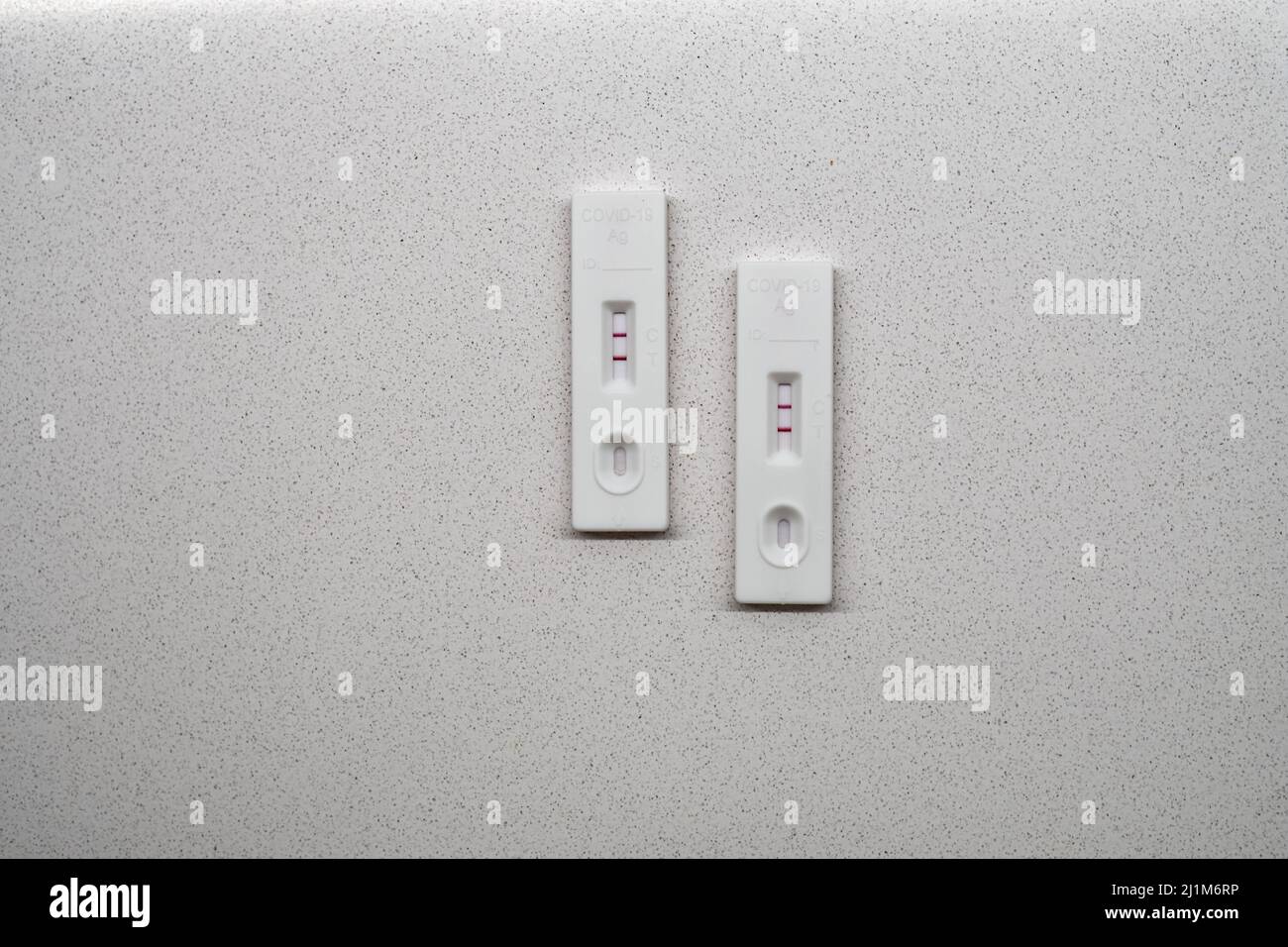 Two white positive covid19 antigen test on a white background close up ...