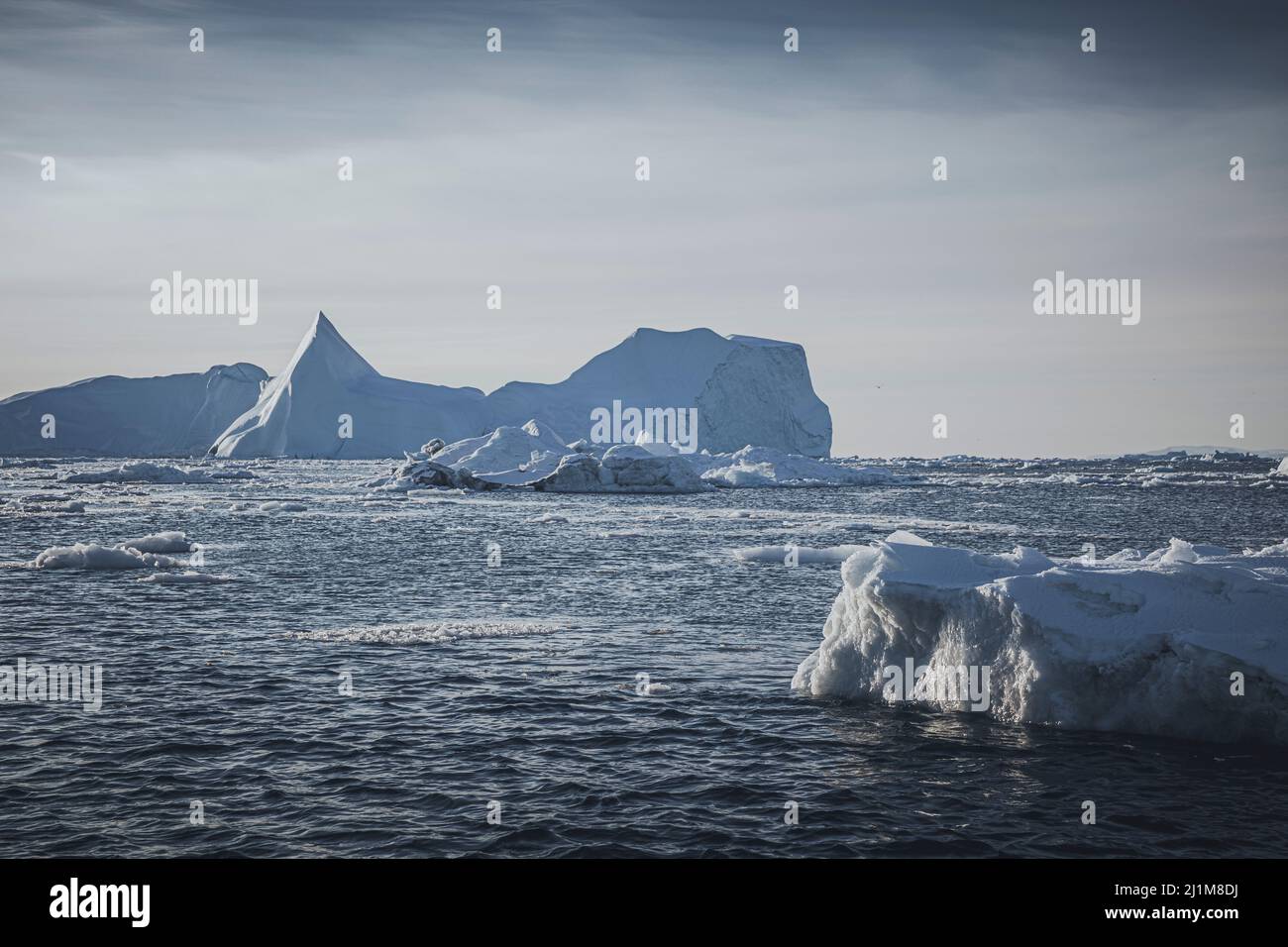 Big icebergs floating over sea Stock Photo
