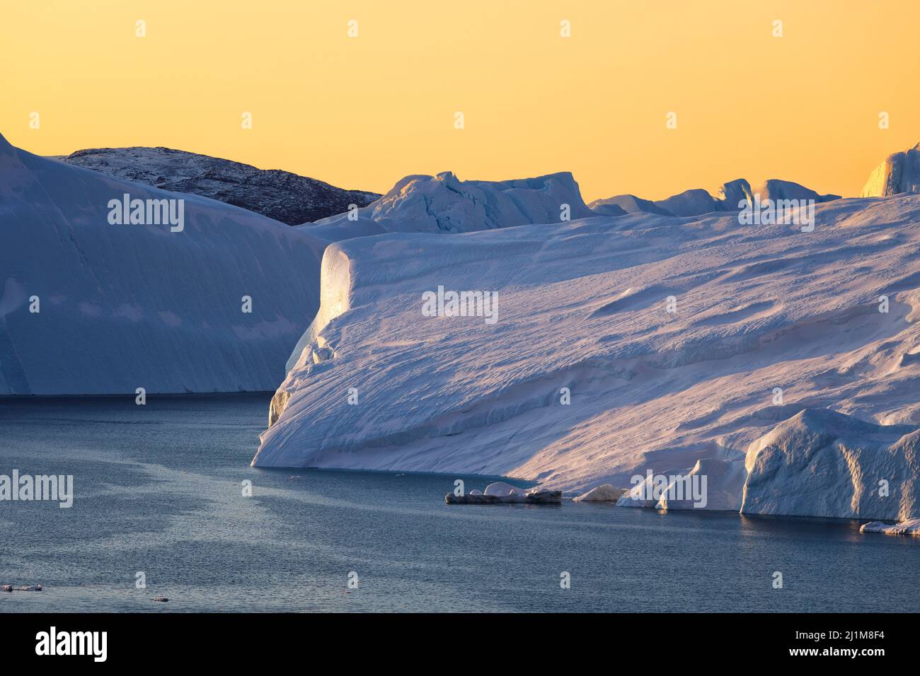 Big icebergs floating over sea Stock Photo