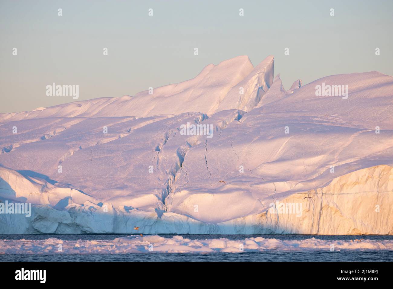 large icebergs floating in the sea in the arctic circle Stock Photo