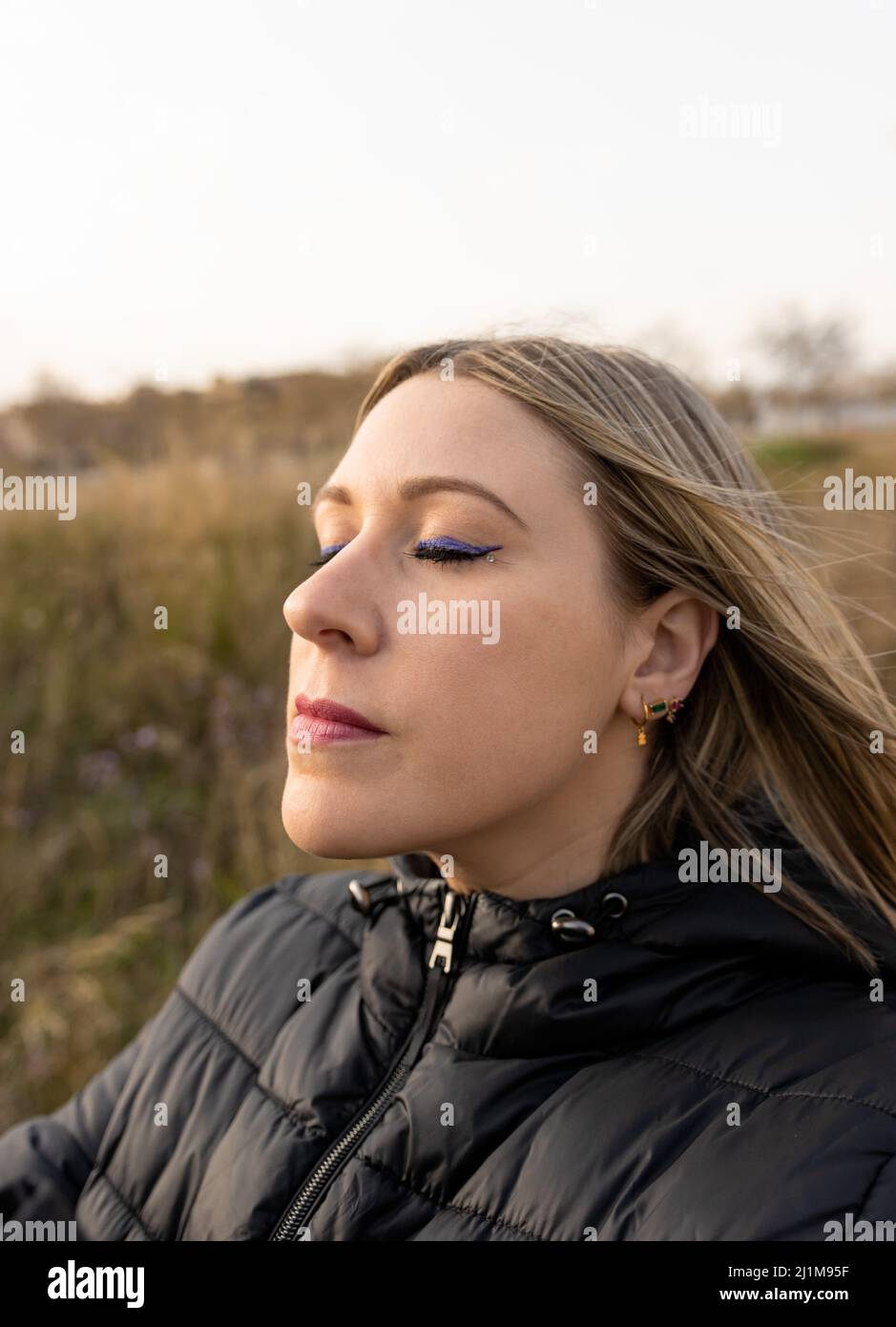 Young woman enjoying the peace and quiet in nature Stock Photo
