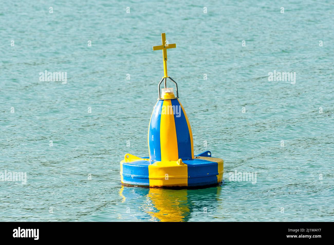 Blue and yellow marine wreck navigation buoy Stock Photo Alamy