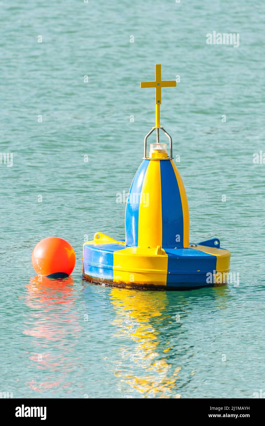 Blue and yellow marine wreck navigation buoy. Stock Photo