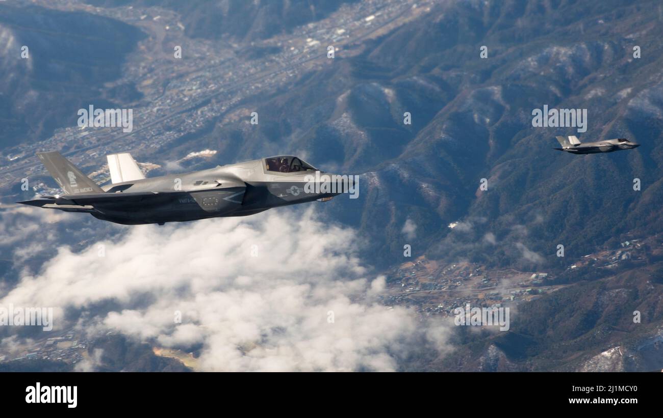 U.S. Marine Corps F-35B Lightning II’s with Marine Fighter Attack Squadron (VMFA) 121 fly near Mt. Fuji, Japan, March 23, 2022. Marines with Marine Aerial Refueler Transport Squadron 152 supported Marines with VMFA-121 during a training flight simulating close air support at Camp Fuji, Japan. Marine Corps aviation routinely conducts training throughout the region to remain combat-ready in support of a free and open Indo-Pacific and to demonstrate our commitment to the Treaty of Mutual Cooperation and Security between the U.S. and Japan. (U.S. Marine Corps photo by Cpl. Tyler Harmon) Stock Photo