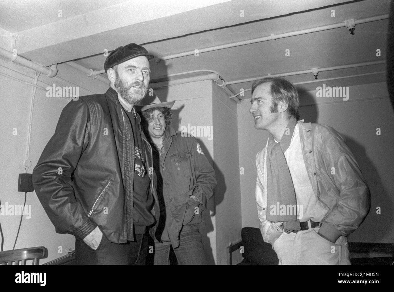English journalist Karl Dallas, American musician Arlo Guthrie and English musician Roy Harper backstage at The Venue, London on the occasion of Karl's 50th birthday celebrations in 1981. Stock Photo