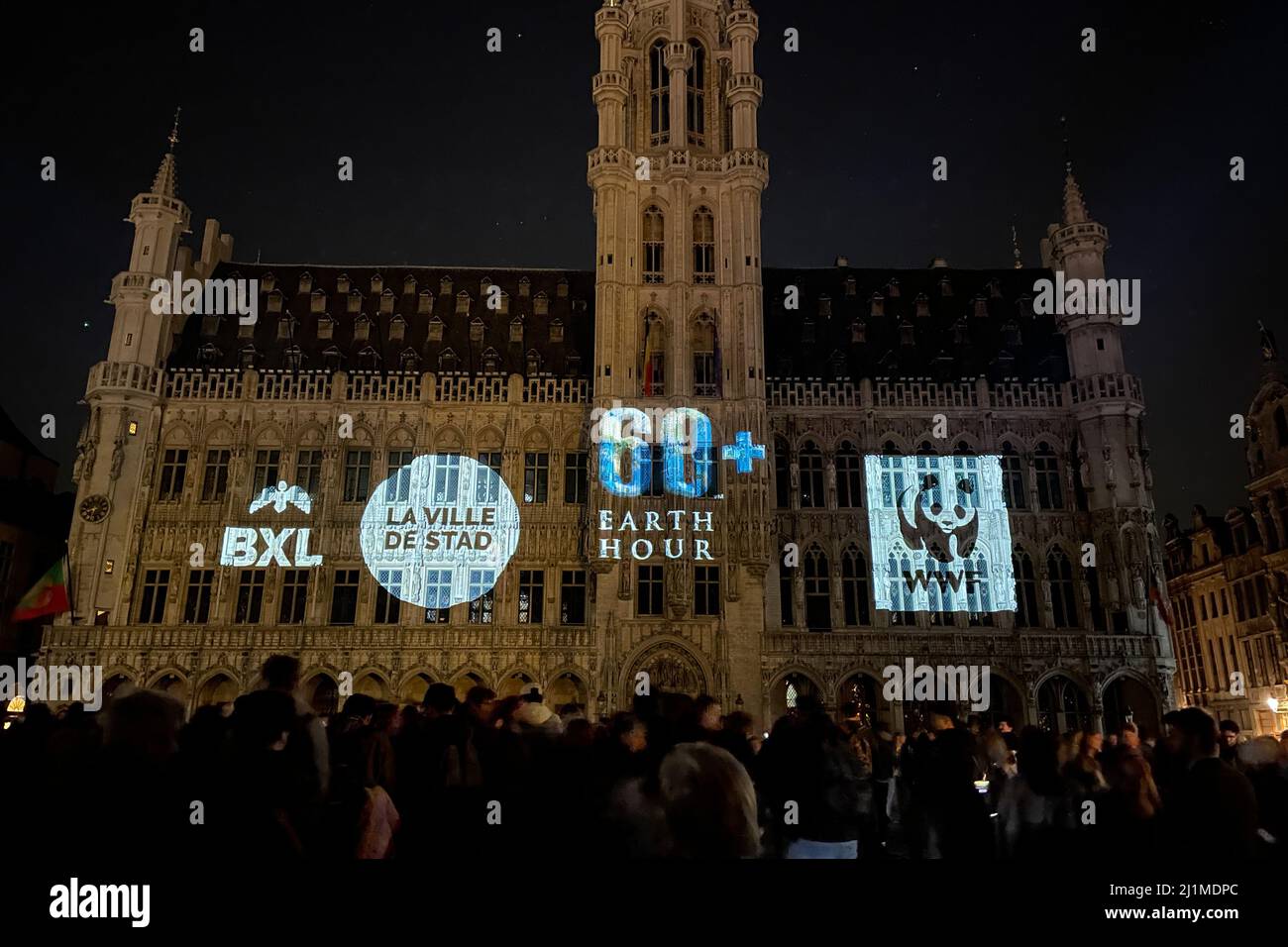 Brussels, Belgium. 26th Mar, 2022. The Brussels Town Hall with lights off is seen during the Earth Hour event at the Grand Place in Brussels, Belgium, on March 26, 2022. Credit: Zheng Huansong/Xinhua/Alamy Live News Stock Photo