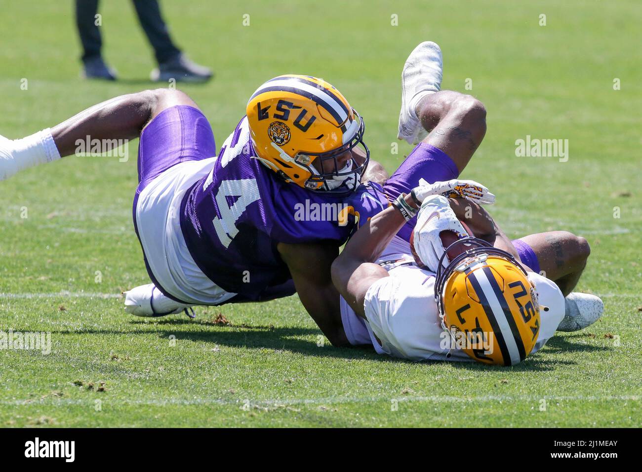 March 26, 2022: LSU wide receiver Chris Hilton Jr. (17) is brought down by  cornerback Jarrick Bernard-Converse (24) during the first week of spring  football practice at the LSU Charles McClendon Practice Facility in Baton  Rouge, LA. Jonathan Mailhes/CSM ...