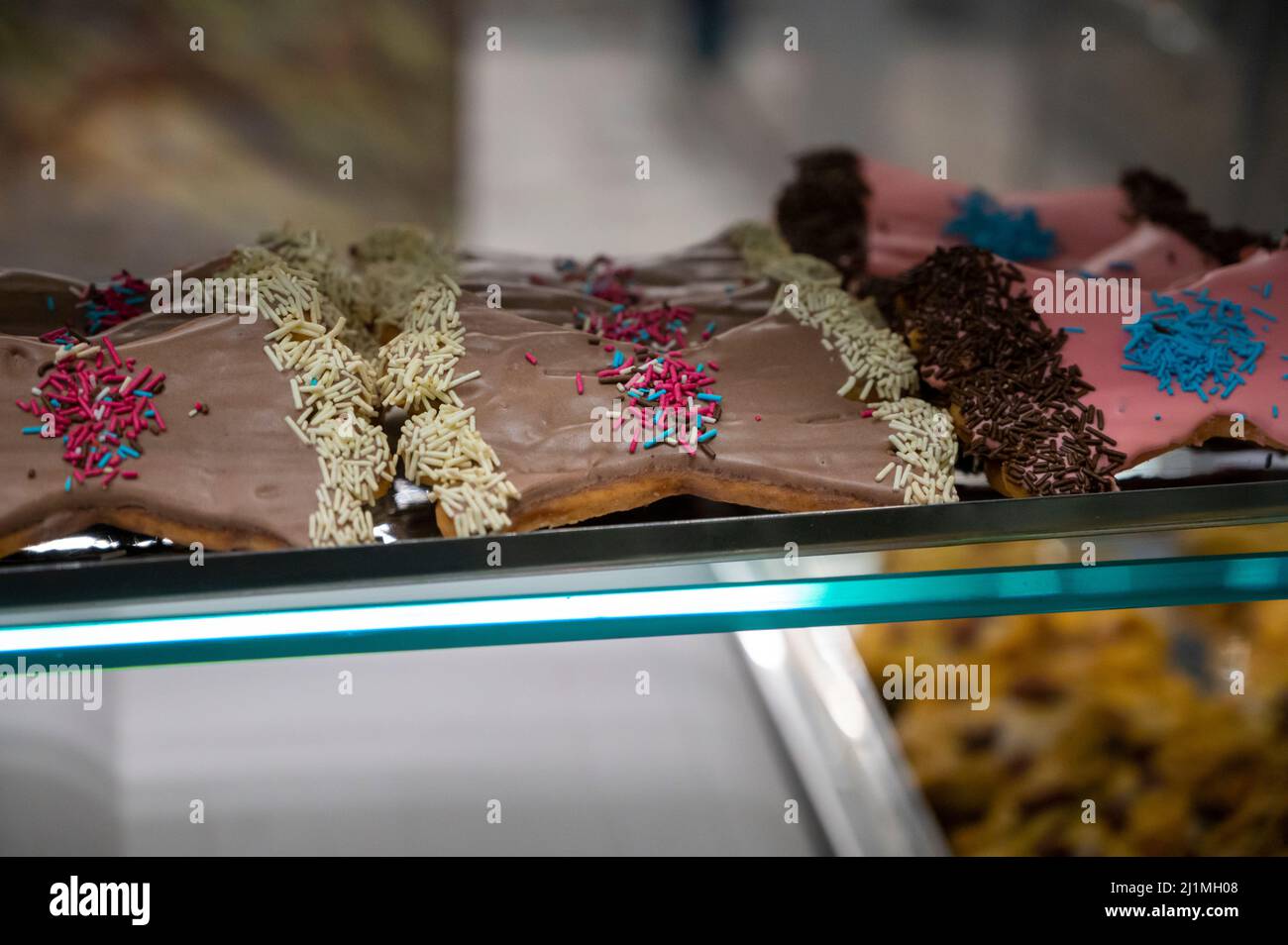Sweet colorful bowshaped biscuits on display at Italian bakery Stock