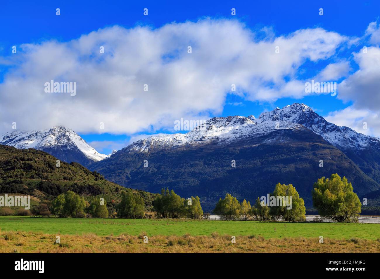 The snow-capped Humboldt Mountains, part of New Zealand's Southern Alps, seen from 'Paradise' a rural locale north of Glenorchy Stock Photo