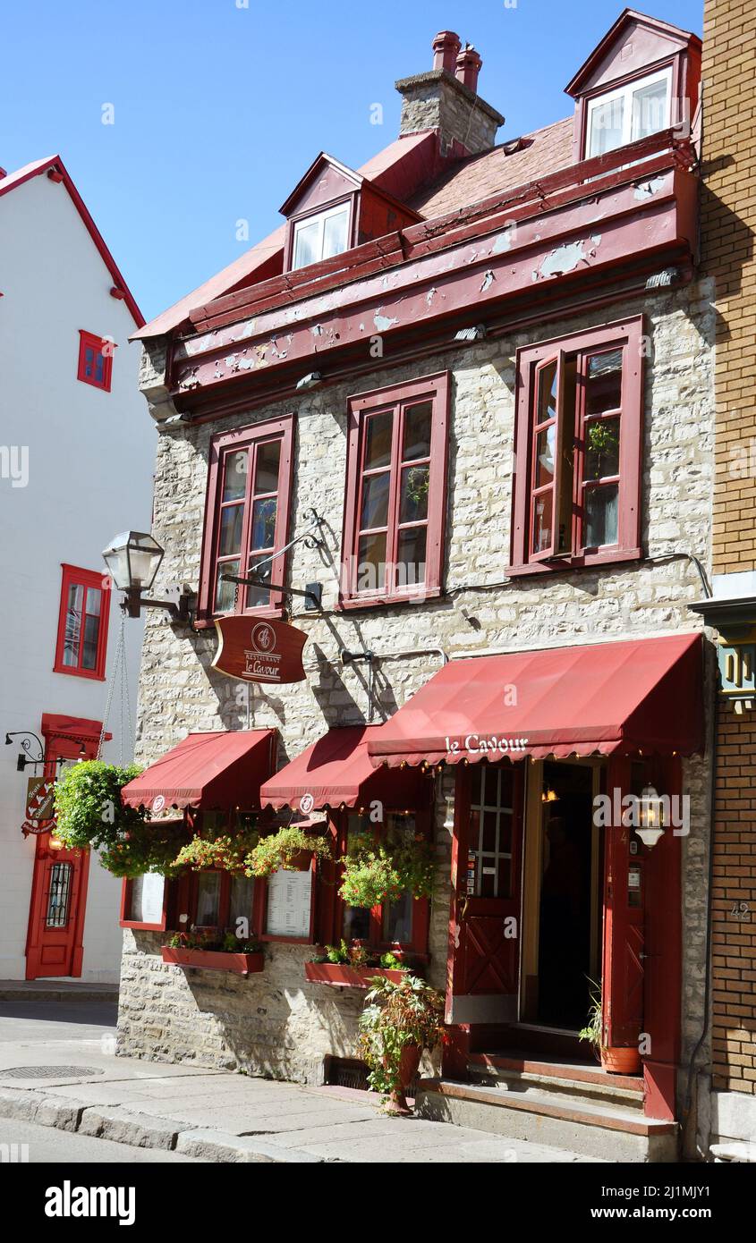 Historic French style commercial building at 44 Rue Saint-Louis Street ...