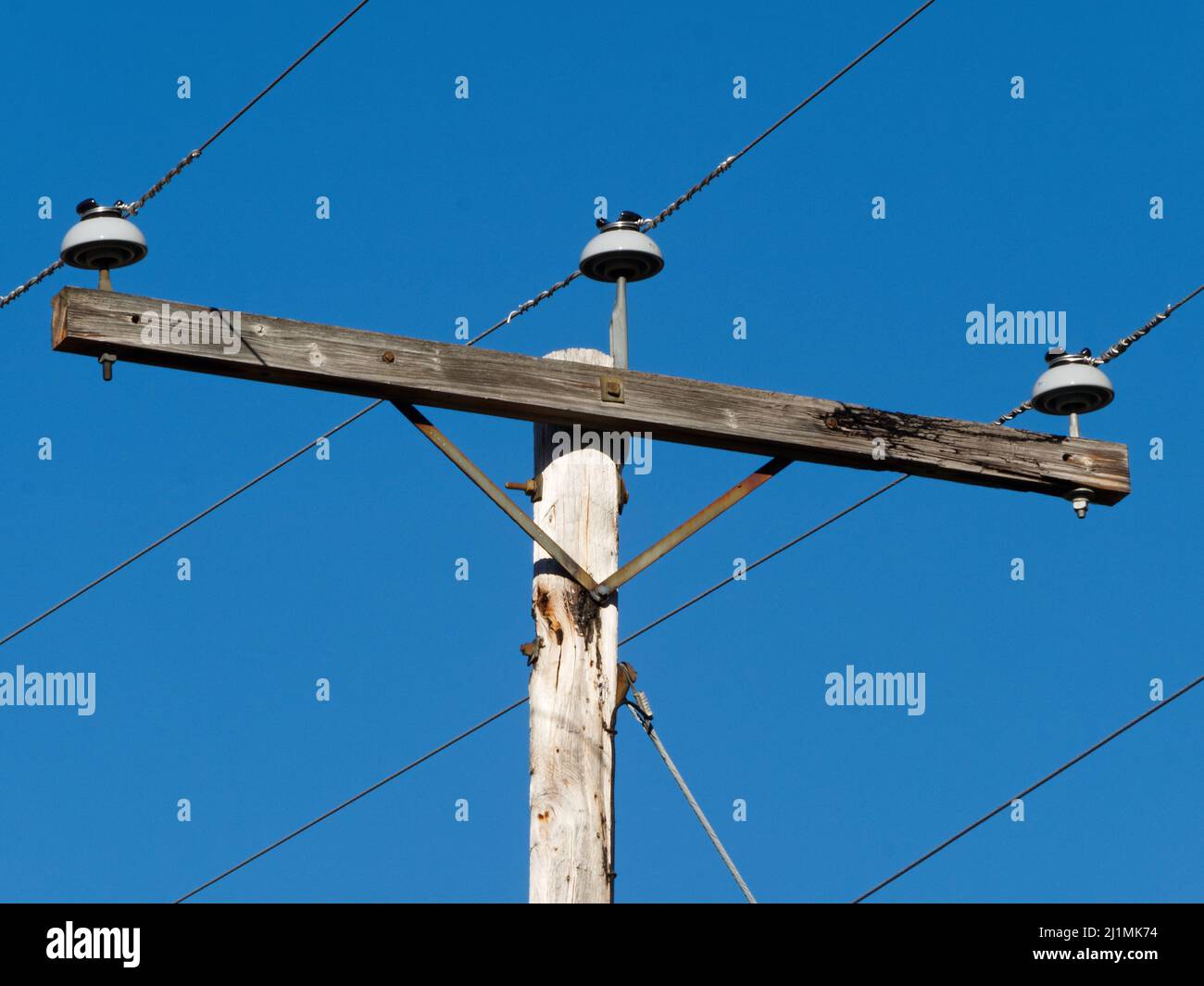 Electric wires on a wooden utility pole. Quebec,Canada Stock Photo