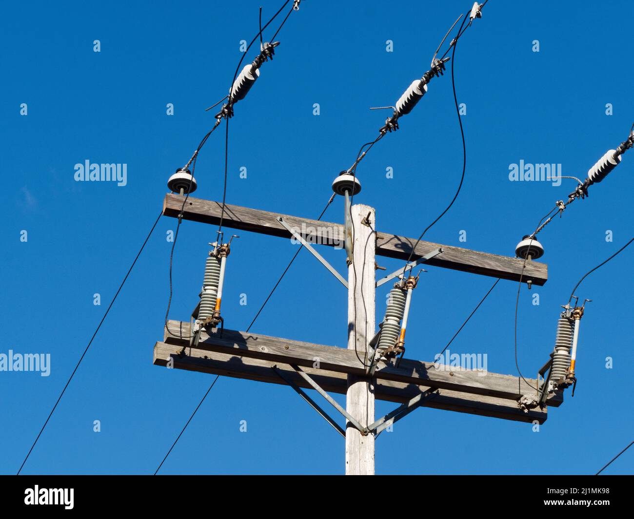 Electric wires on a wooden utility pole. Quebec,Canada Stock Photo