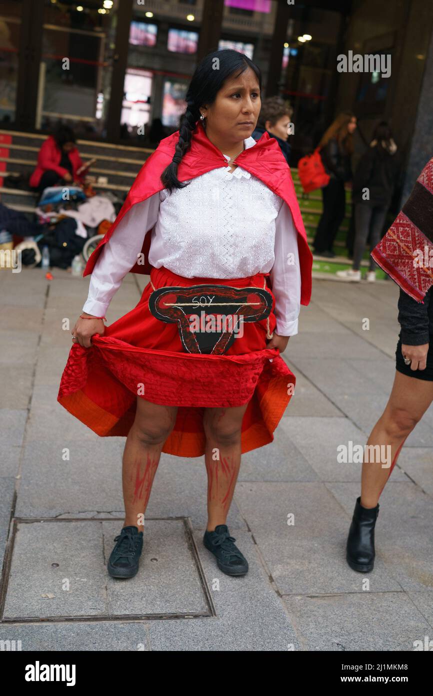 Madrid, Spain. 26th Mar, 2022. A woman with her legs painted to simulate blood represents an abortion during the demonstration. Protest for the decision of the Constitutional Court of Peru to release Alberto Fujimori, in the Plaza de Callao in Madrid. Peru's constitutional court on March 17th ordered the release of Fujimori, who is serving a 25-year sentence for crimes against humanity. Credit: SOPA Images Limited/Alamy Live News Stock Photo